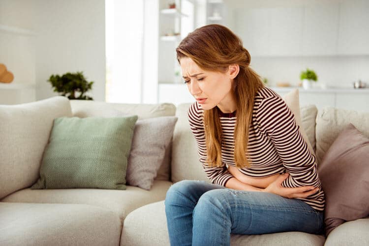 Woman having endometriosis cramps